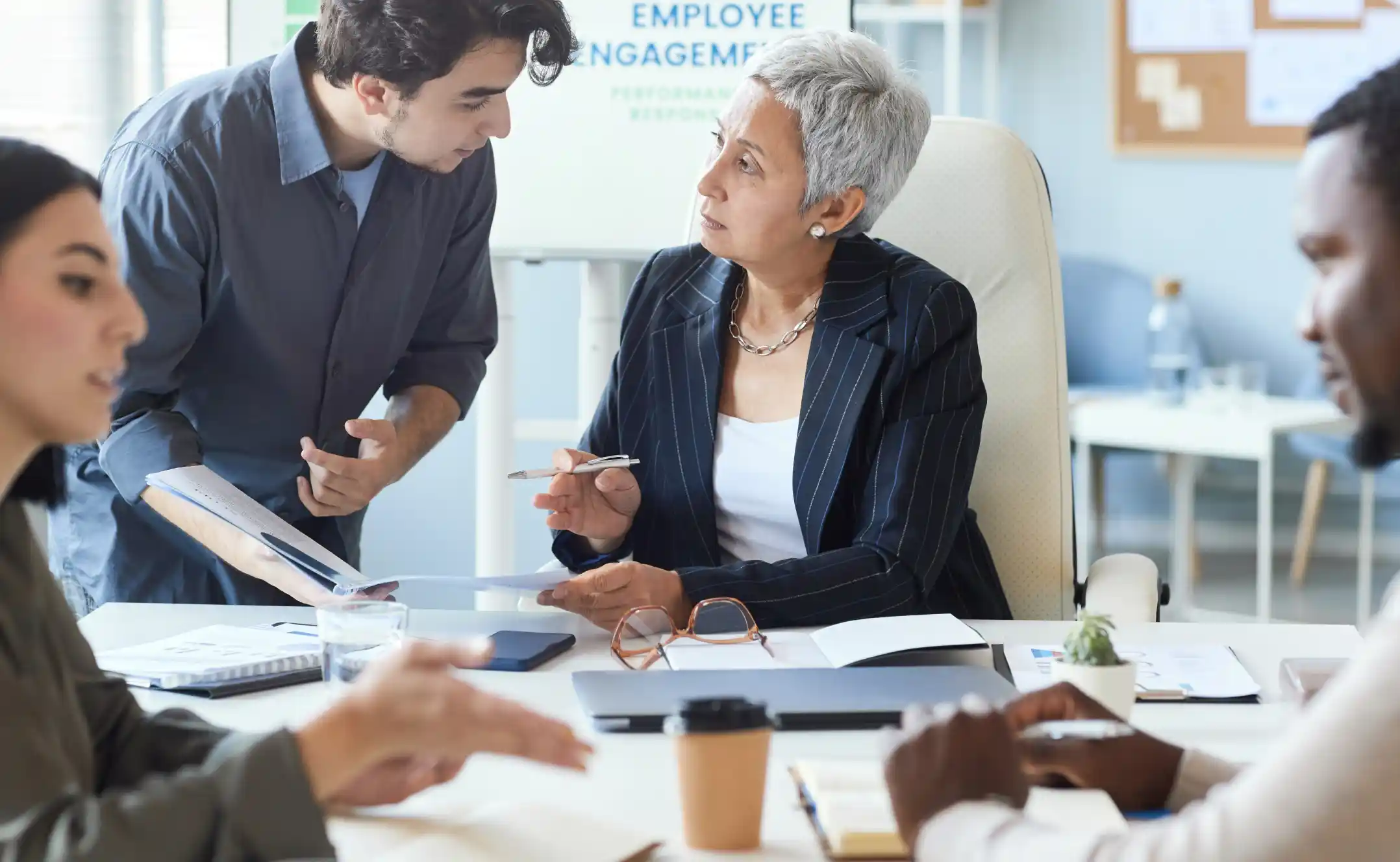 Woman executive leading a team meeting