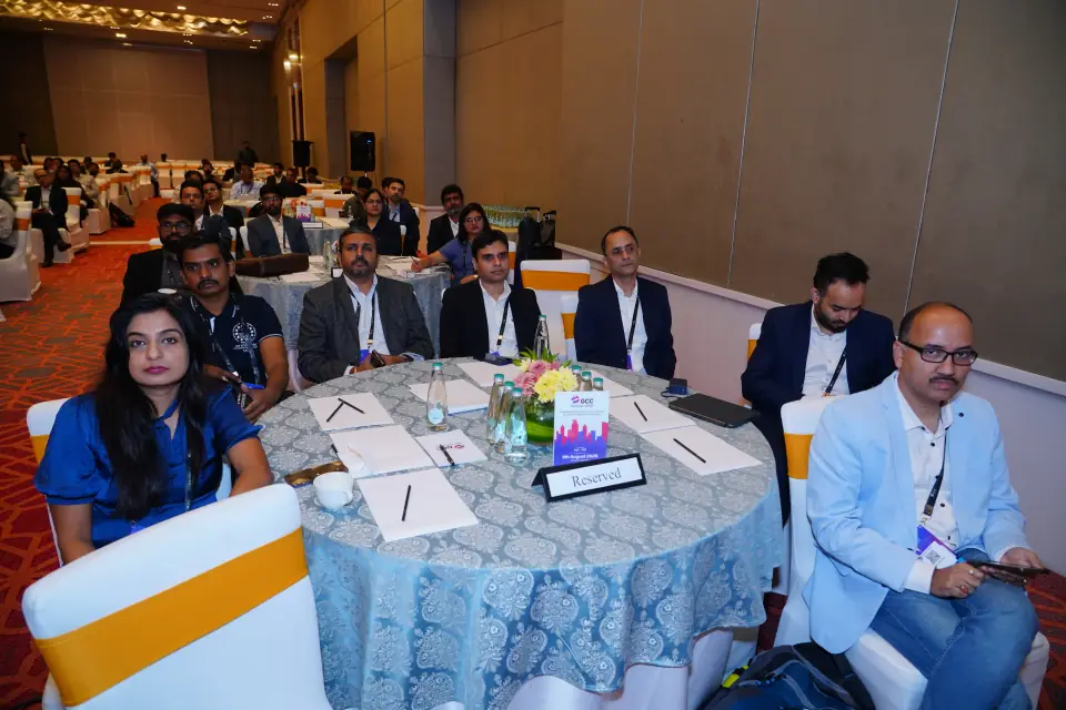 Delegates at a roundtable in the main hall