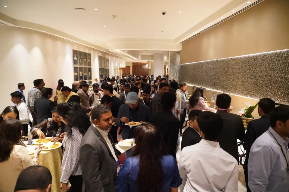 Delegates networking in the main hall
