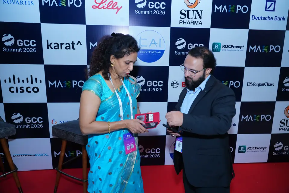 Delegates meeting at the partner backdrop