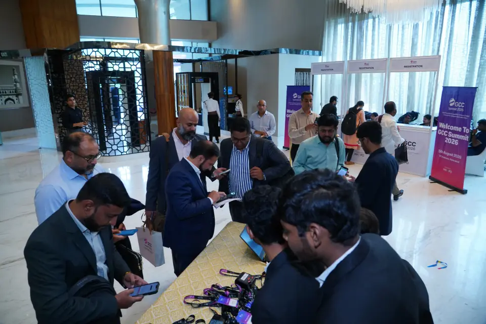 Delegates collecting their badges at registration